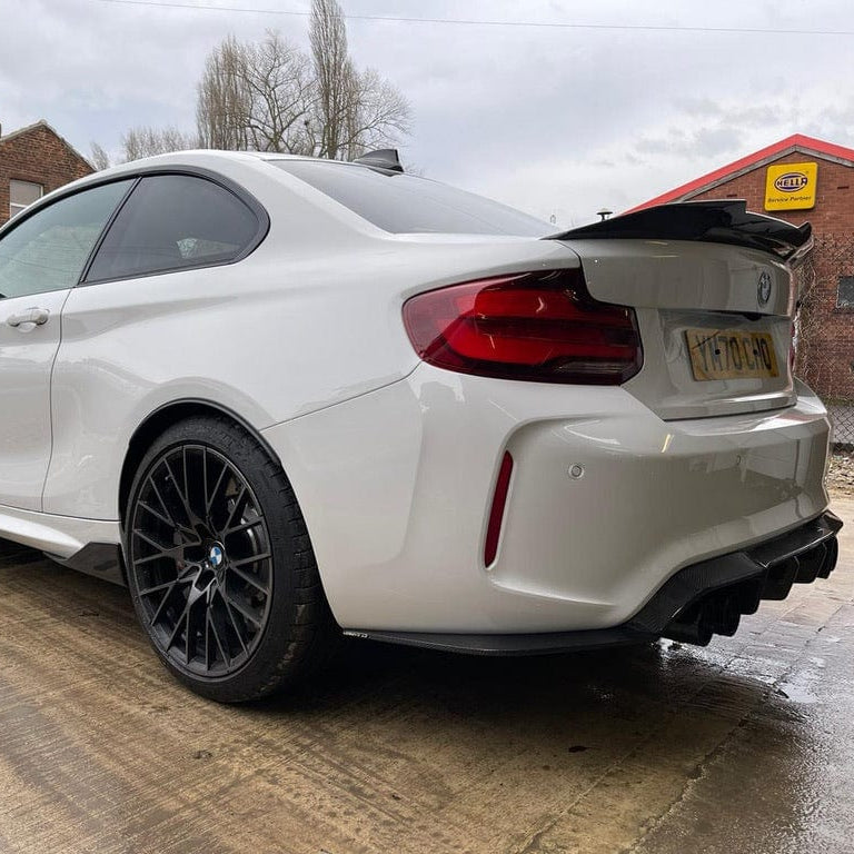 BMW F87 M2 CT Carbon full carbon fibre kit, V3 style, including front, side, and rear components, showcased on the car.