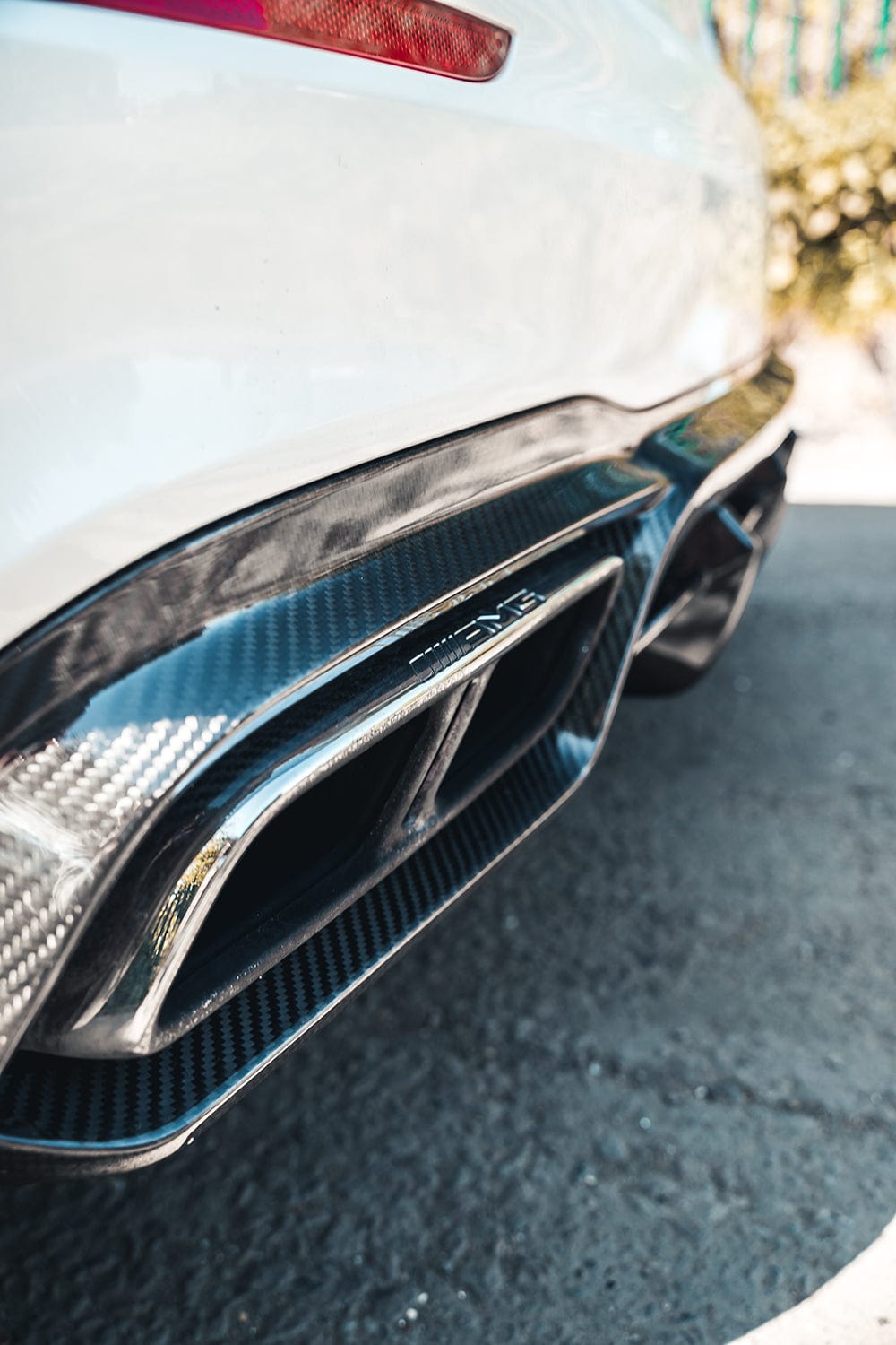 Mercedes E63 W213 2018-2020 CT Carbon fiber diffuser installed on the rear of the car, showcasing sleek, high-quality carbon fiber finish.