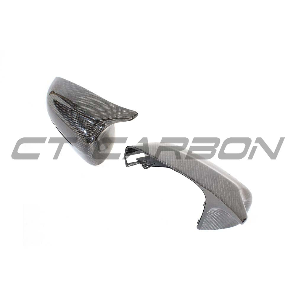 BMW 3, 4, 5 Series G20, G22, G26, G30 carbon fibre mirror replacements by CT Carbon, RHD only, close-up of glossy black mirrors.