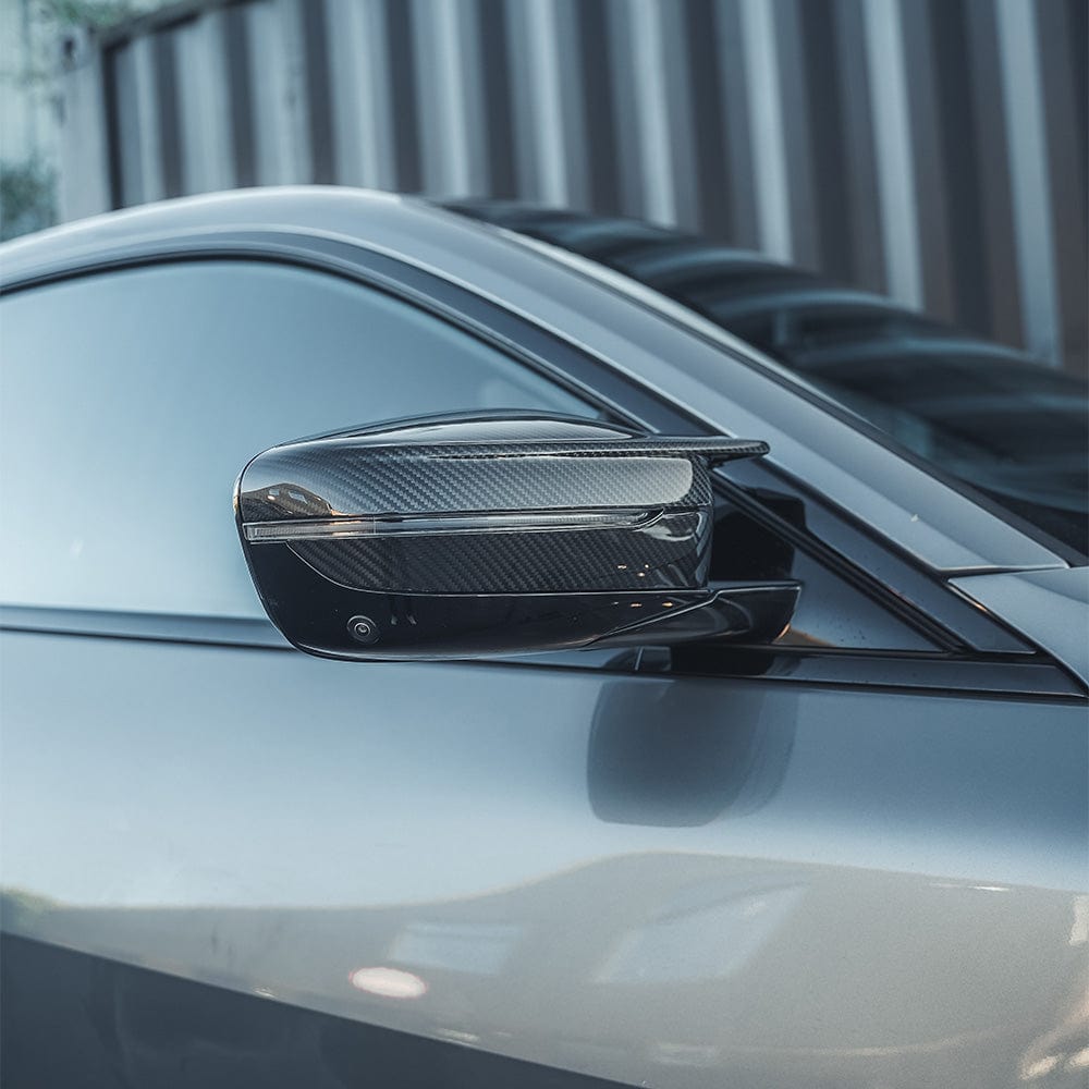 BMW M2 M3 M4 G80 G82 G83 G87 carbon fibre replacement mirrors by CT Carbon, LHD, showing sleek, lightweight carbon fiber design.