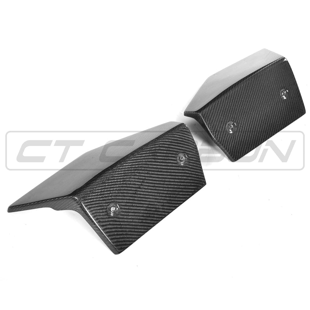 BMW F16 X6 carbon fiber rear bumper extensions from CT Carbon, showcasing sleek aerodynamic accessories on the vehicle's rear bumper.