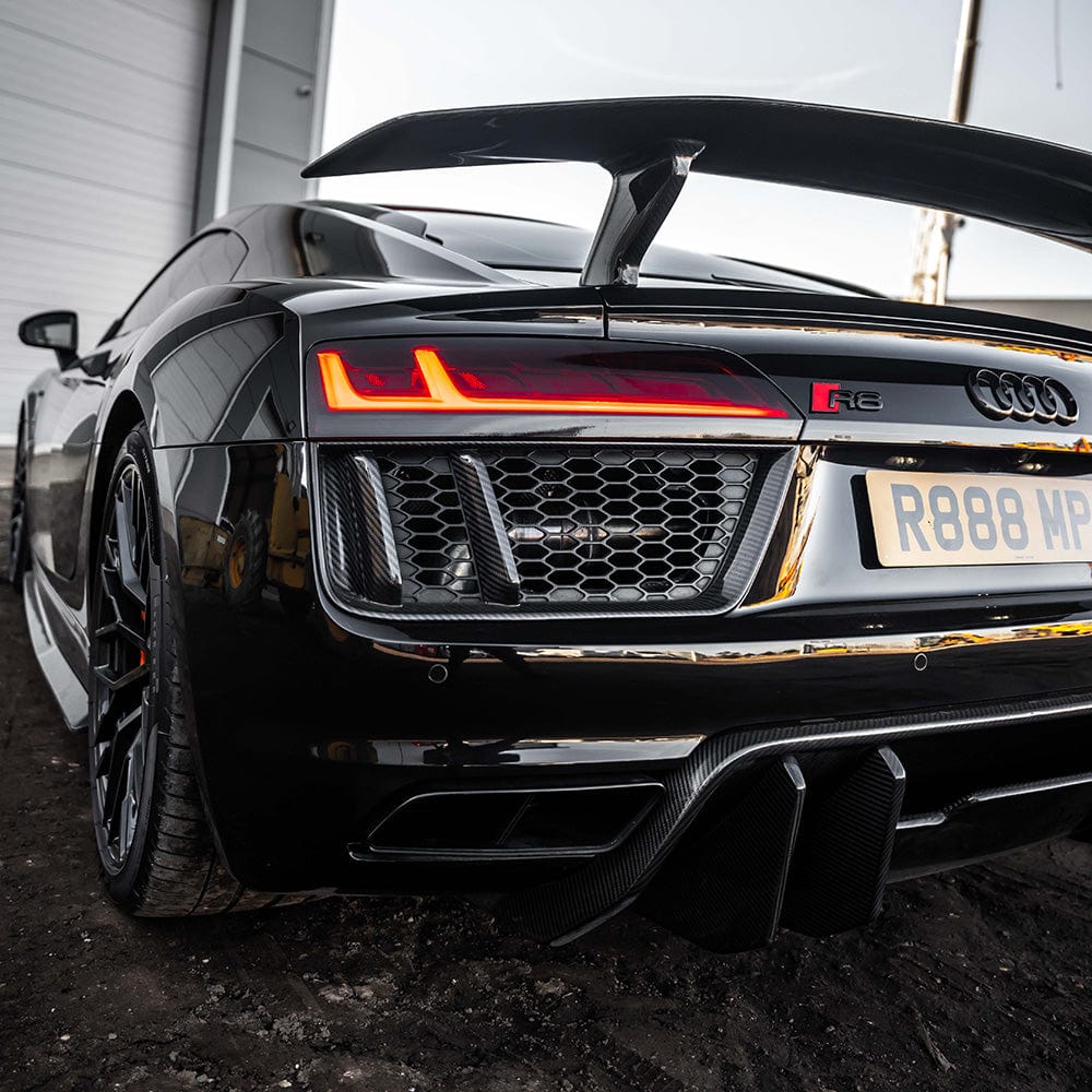 Carbon fibre rear side grille for Audi R8 V10 Gen 2 by CT Carbon, showcasing sleek, textured design on a high-performance sports car.