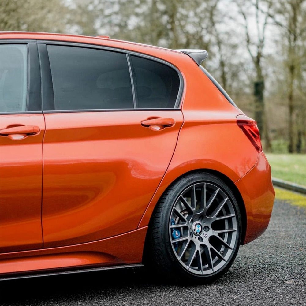 BMW 1 & 2 Series F20, F22, F23 carbon fibre side skirts by CT Carbon, showcasing sleek MP style design on the vehicle.