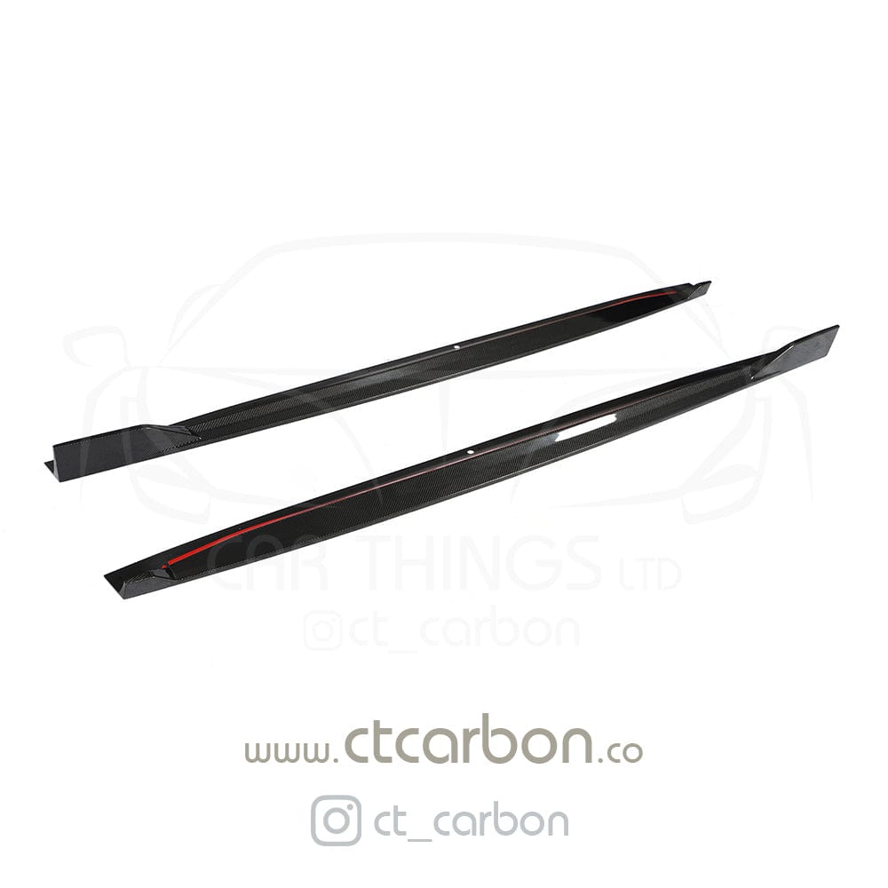BMW X5 G05 CT Design carbon fibre side skirts, lightweight and sleek, installed along the vehicle's lower sides for enhanced style.