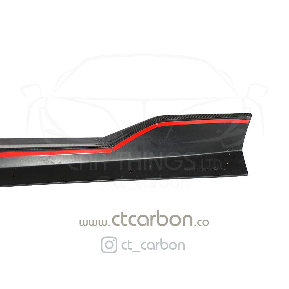 BMW X5 G05 CT Design carbon fibre side skirts, sleek and aerodynamic, installed along the vehicle's lower sides.