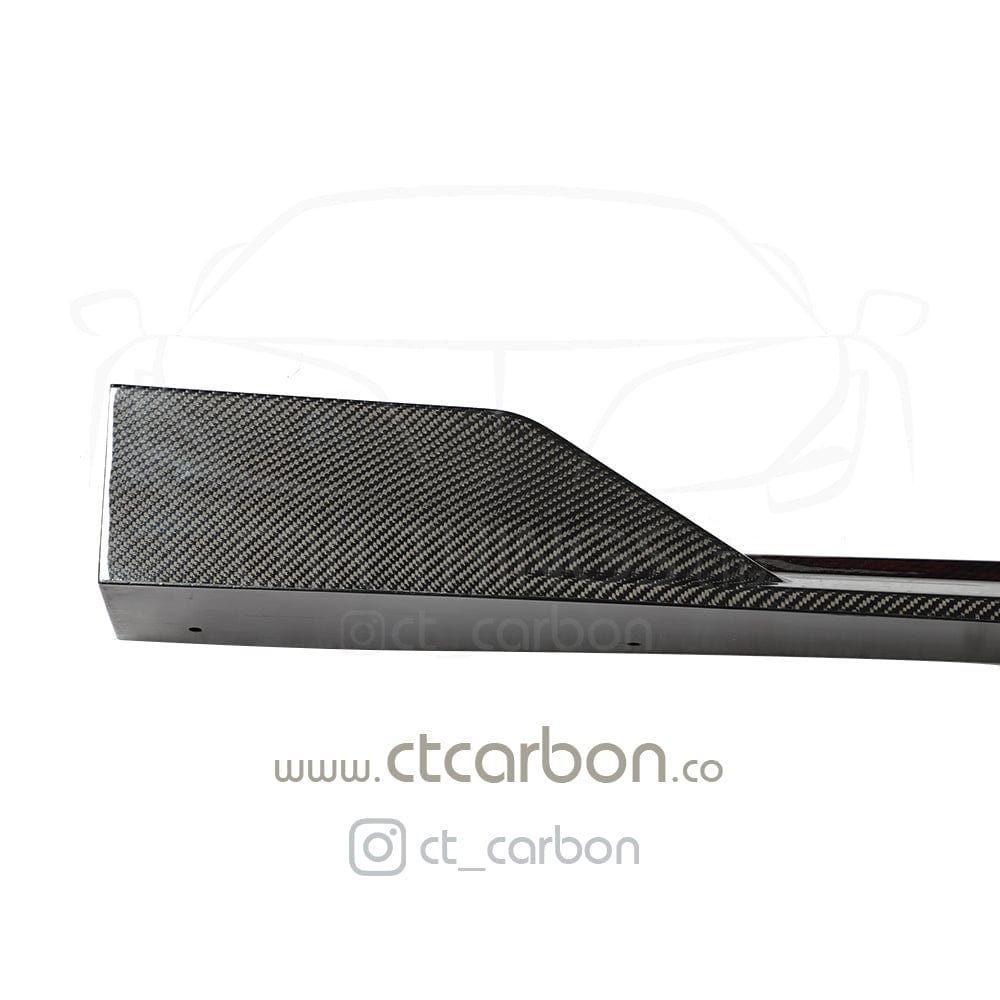 BMW X5 G05 CT Design carbon fibre side skirts, showcasing sleek, lightweight automotive accessories with a textured finish.