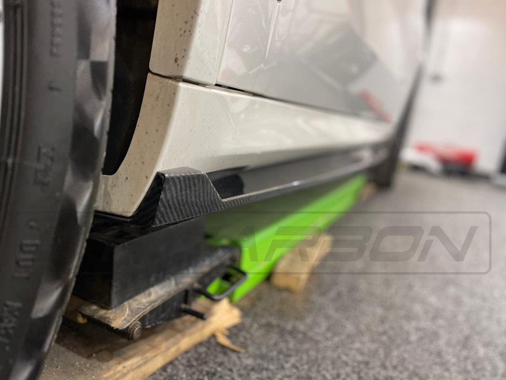 BMW X5 G05 CT Design carbon fibre side skirts installed on vehicle, showcasing sleek, aerodynamic side panel enhancements.