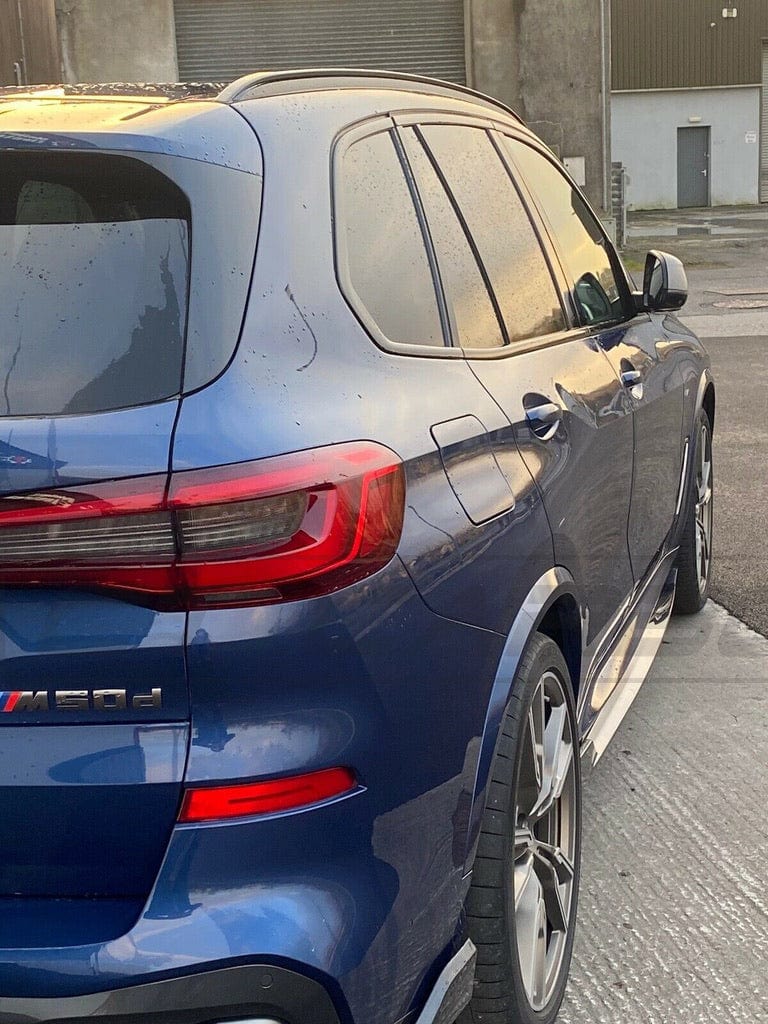 BMW X5 G05 CT Design carbon fiber side skirts, sleek aerodynamic enhancement for the vehicle's side profile.