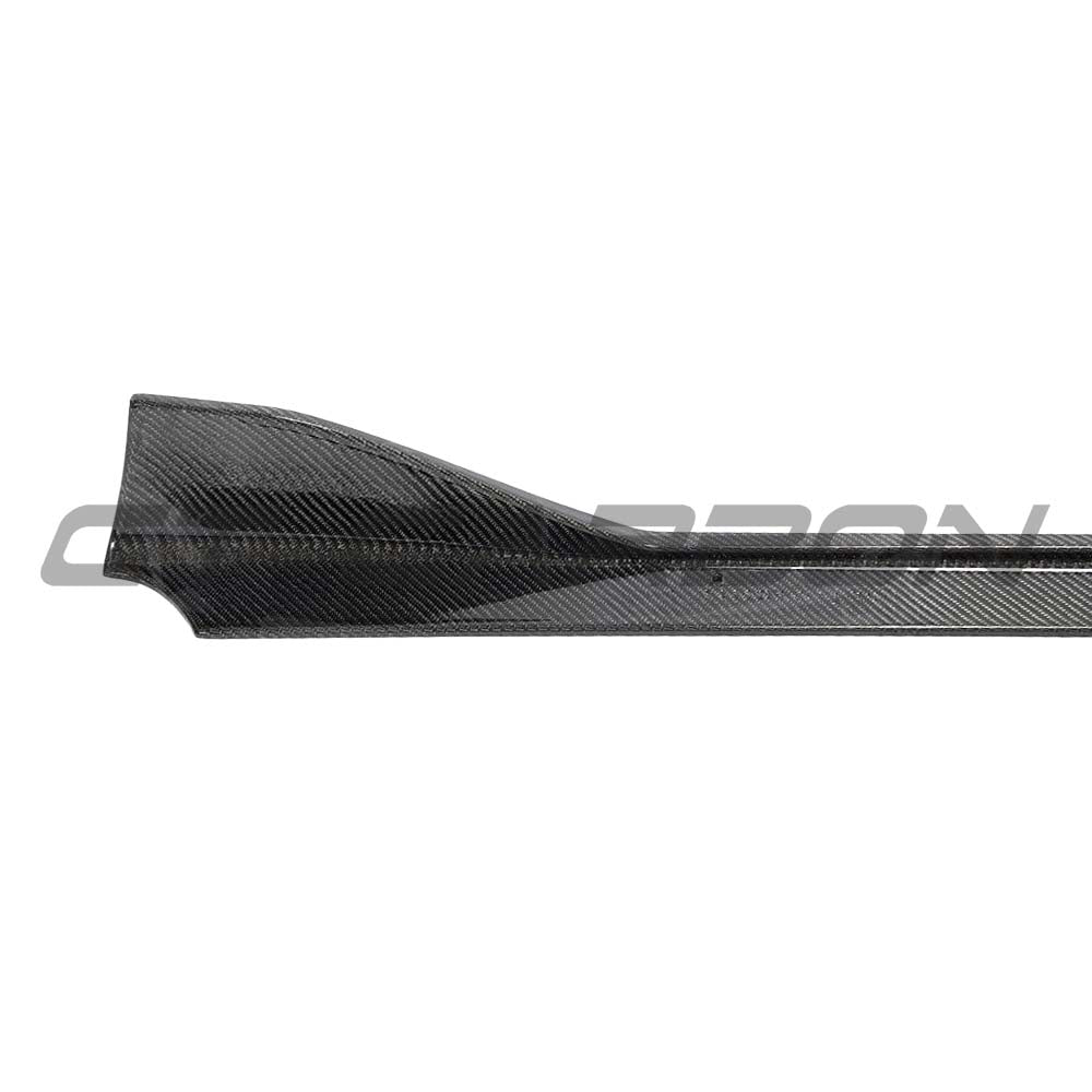 Toyota Supra 2019+ A90 CT Carbon carbon fiber side skirts installed on the vehicle, showcasing sleek aerodynamic design.