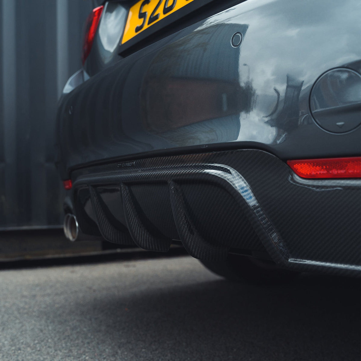 BMW F32 4 Series Coupe CT Carbon full carbon fiber kit with splitter and twin exhaust visible, showcasing sleek, lightweight performance parts.