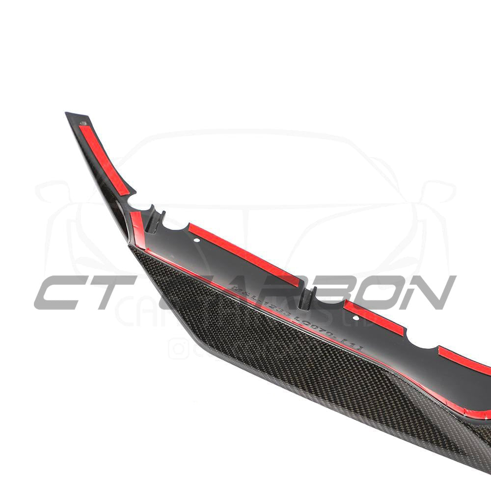 BMW F90 M5 Competition carbon fibre splitter by CT Carbon, showing the sleek R-style design on the front bumper.