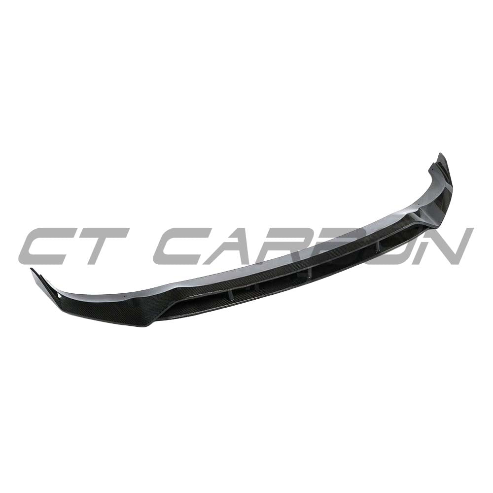 BMW G05 X5 full carbon fiber kit by CT Carbon, featuring splitters and aerodynamic enhancements on a sleek black vehicle.