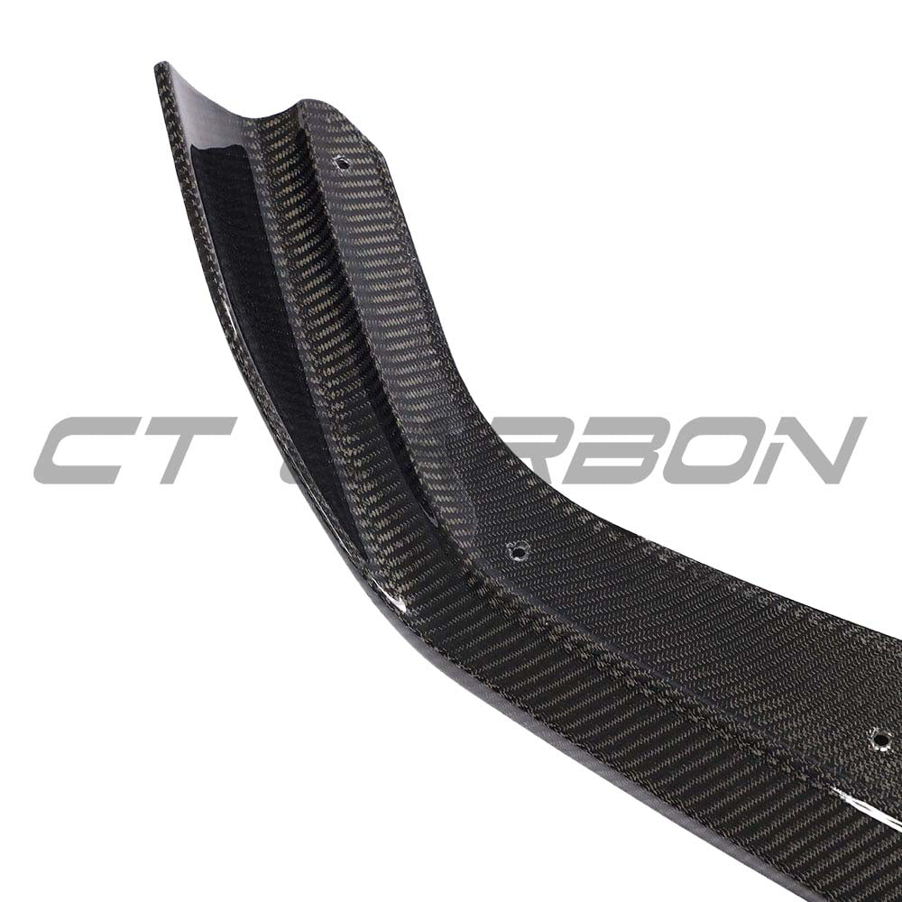 BMW M2 F87 carbon fiber splitter by CT Carbon, V6 style, showcasing the sleek, aerodynamic front splitter in close-up detail.