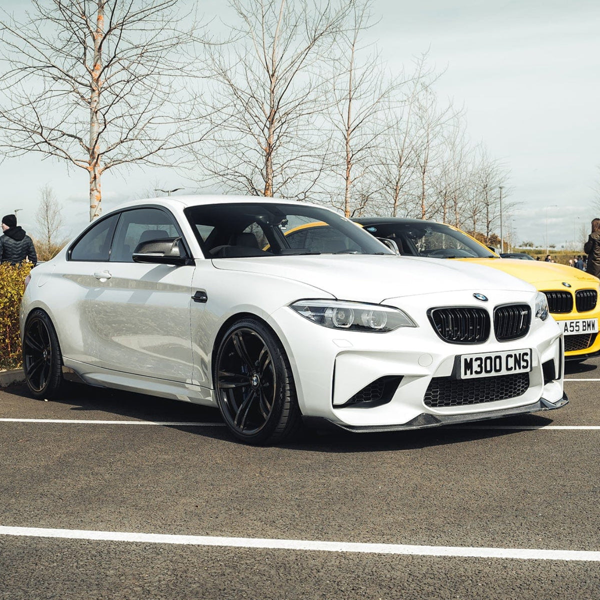BMW M2 F87 carbon fiber splitter by CT Carbon, V6 style, showcasing the sleek, textured carbon fiber finish on the front splitter.