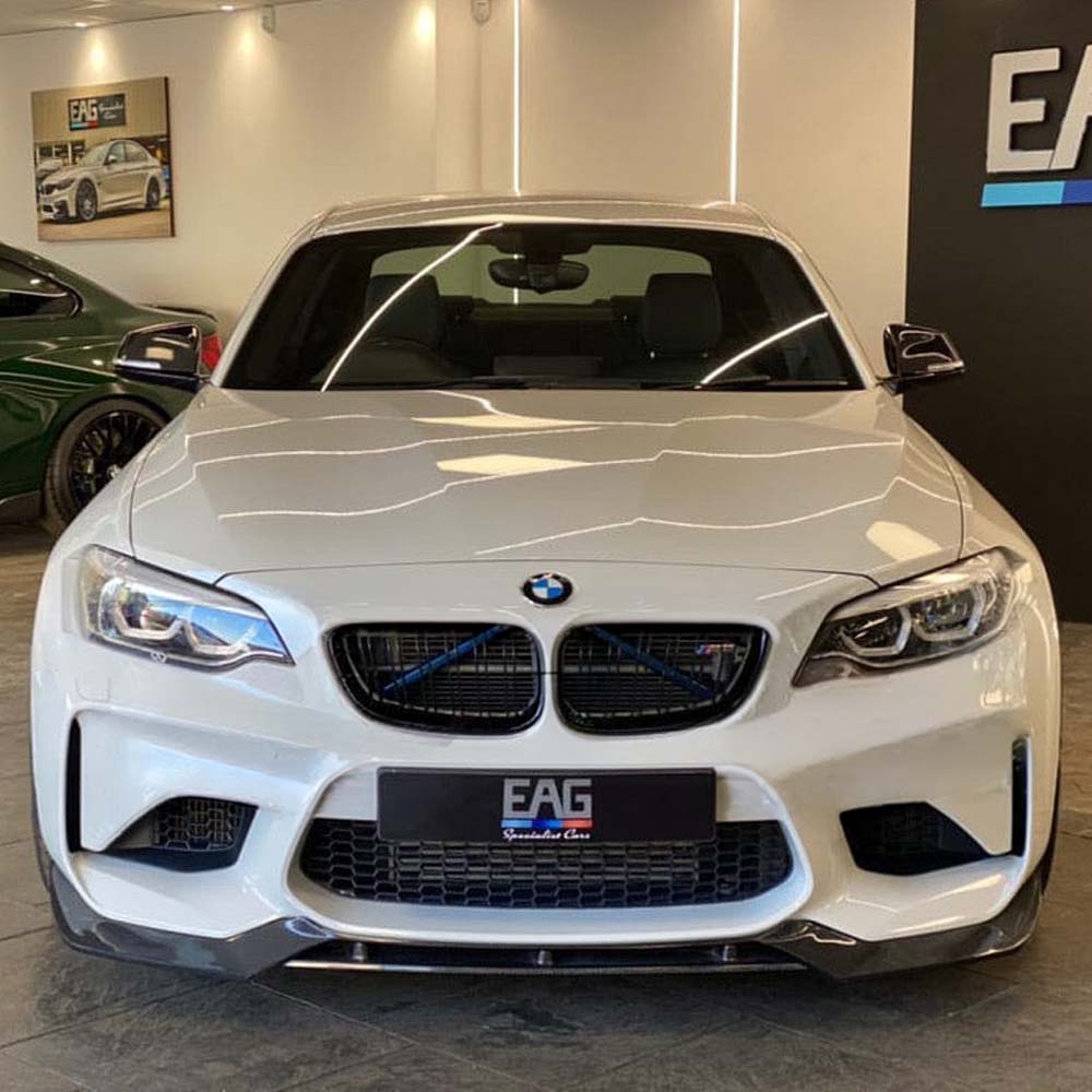 BMW M2 F87 N55 CT Carbon V3 carbon fibre splitter showing the sleek, aerodynamic design with textured carbon fiber surface.