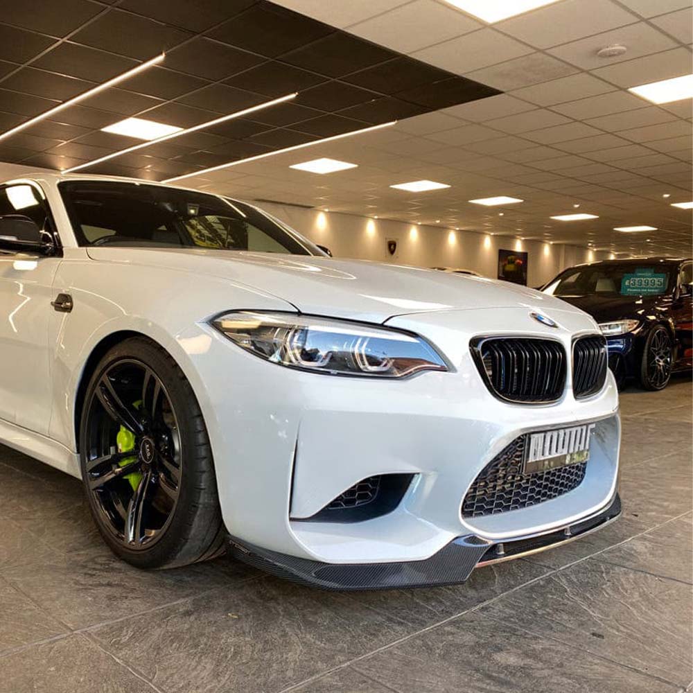 BMW M2 F87 N55 CT Carbon V3 carbon fibre splitter, V-style, mounted on the front of the sporty coupe, showcasing sleek aerodynamic design.