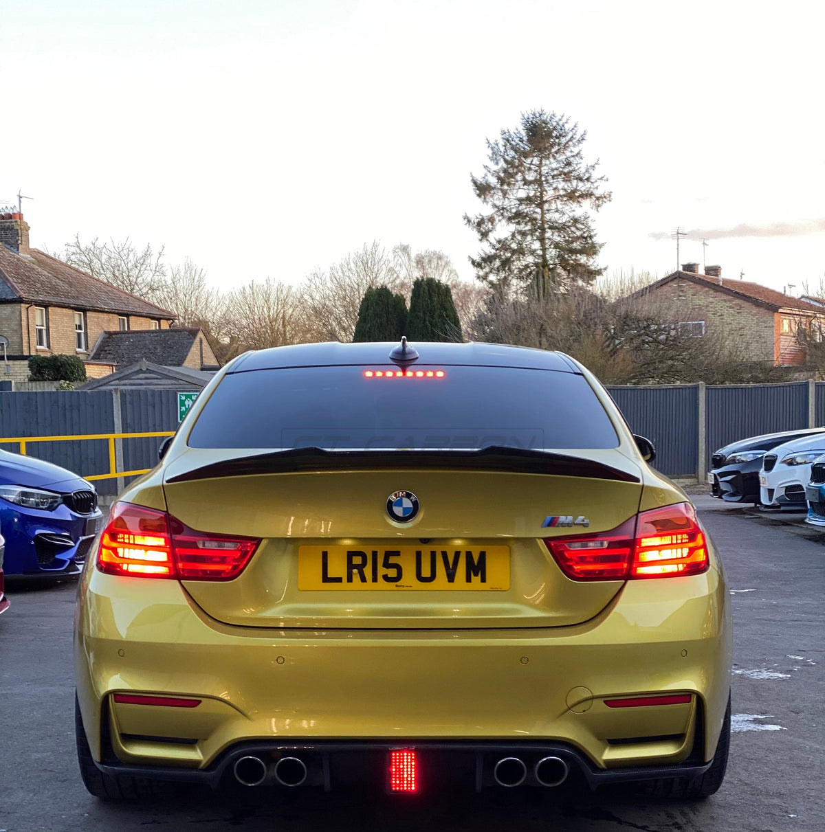 BMW M3 M4 F80 F82 F83 carbon fiber diffuser with DTM light, made by CT Carbon, showing sleek design and aerodynamic features.