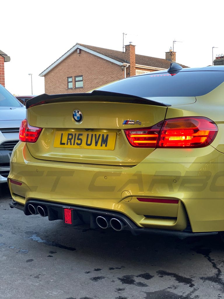 BMW M3 M4 F80 F82 F83 carbon fibre diffuser with DTM light by CT Carbon, showcasing sleek aerodynamic design and high-quality finish.