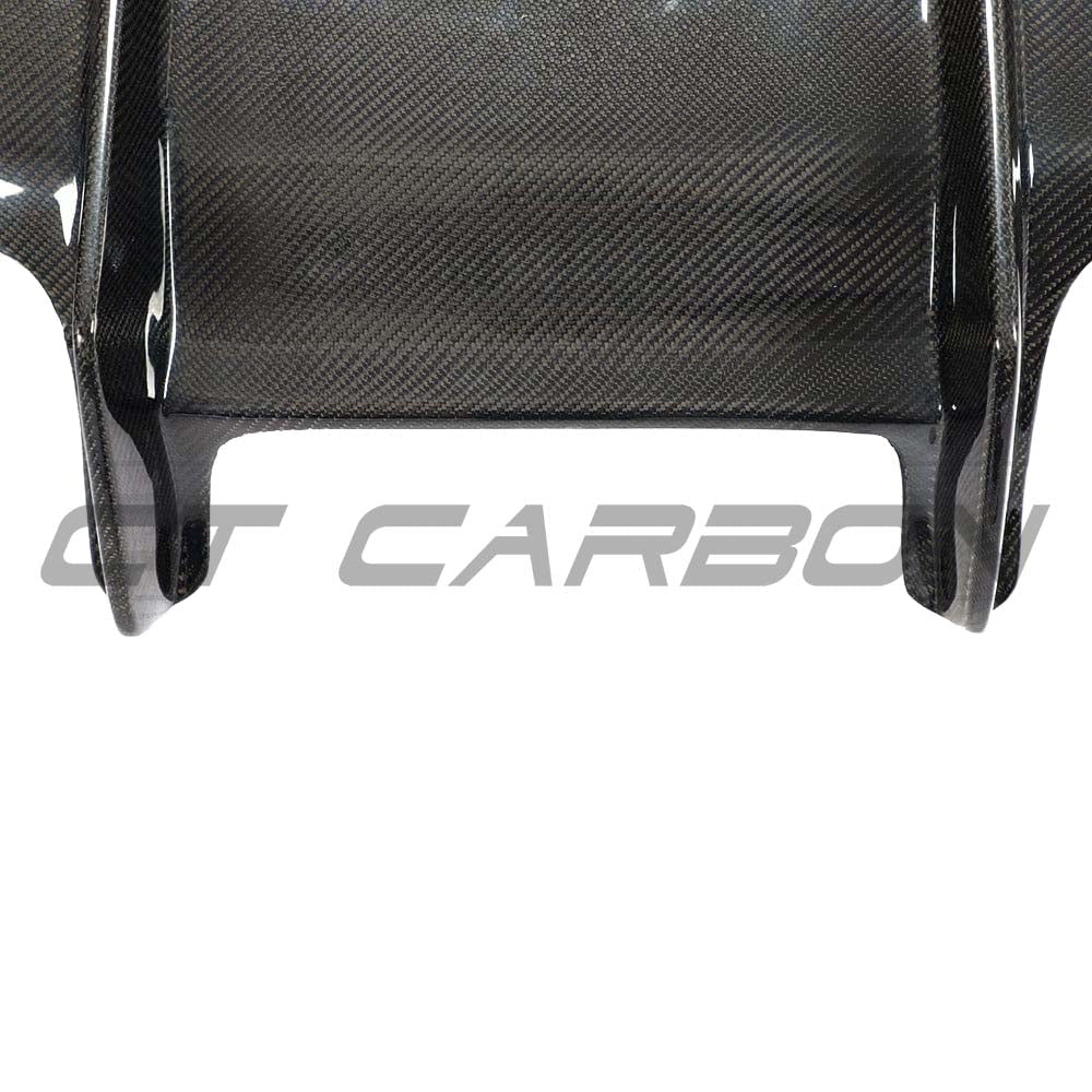 BMW M3 M4 F80 F82 F83 carbon fibre diffuser by CT Carbon, showcasing sleek PS-style design on a sporty vehicle.