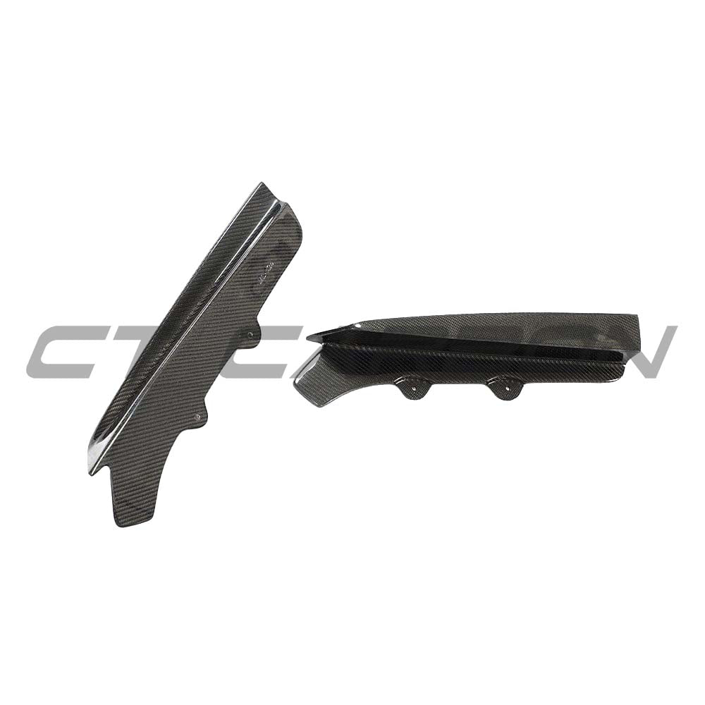 Carbon fiber diffuser for BMW M3 M4 F80 F82 F83 by CT Carbon, showcasing sleek, aerodynamic design on a sporty vehicle.