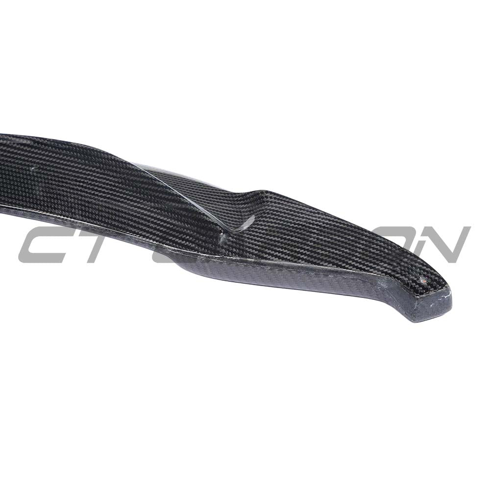 BMW F82 M4 coupe full carbon fibre kit by CT Carbon, including splitters, V-style aerodynamic components, on a sleek car.