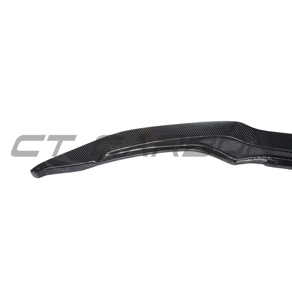 BMW F82 M4 Coupe full carbon fibre kit by CT Carbon, including splitters and body parts, showcasing a sleek V-style design.