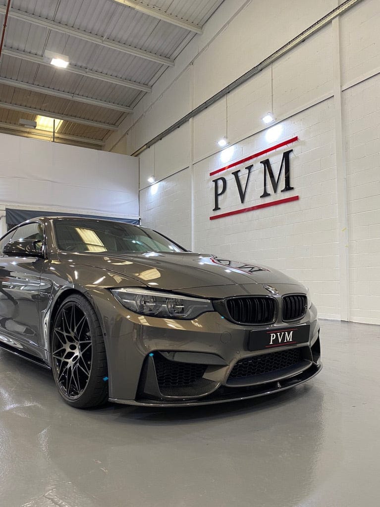Full view of BMW M4 F83 convertible with CT Carbon full carbon fiber kit, including front splitter and aerodynamic enhancements.