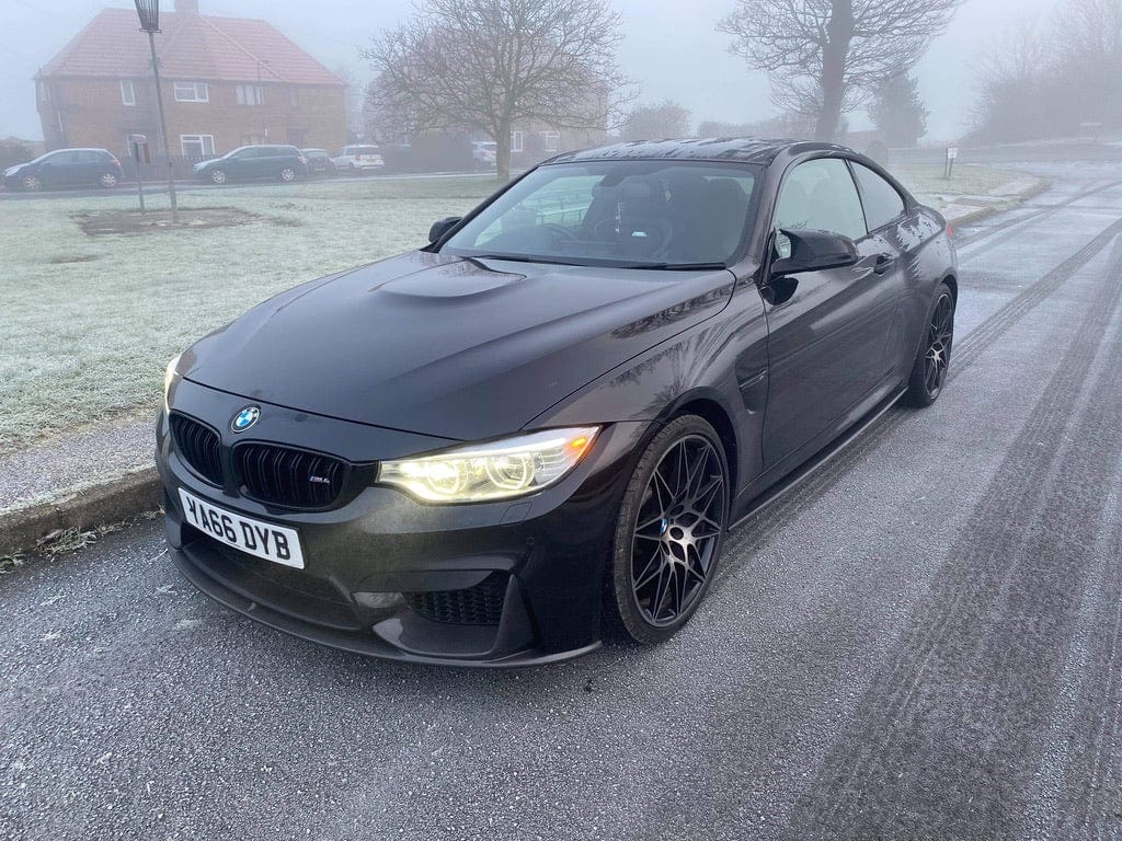 BMW M4 F83 convertible with CT Carbon full carbon fiber kit including splitter and body parts, showcasing a sleek carbon fiber finish.