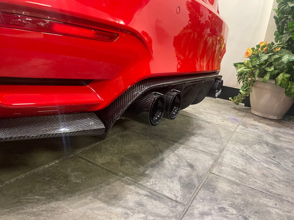 BMW M4 F83 convertible with CT Carbon full carbon fiber kit, including splitter and aerodynamic components, showcasing a sleek, sporty design.