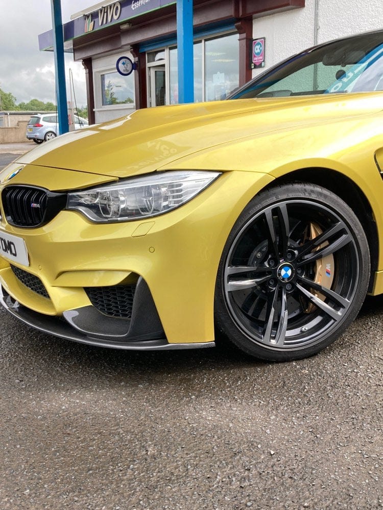 Full view of a BMW M4 F83 convertible with CT Carbon full carbon fibre kit, showcasing the carbon splitter and aerodynamic enhancements.