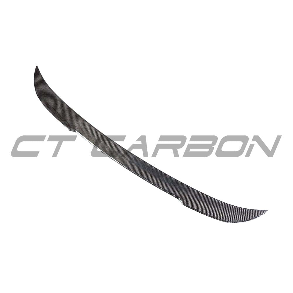 BMW G30 5 Series carbon fibre kit by CT Carbon, featuring splitter and spoiler with a sleek, textured carbon fiber finish.