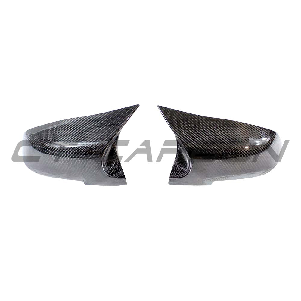 BMW Fxx Series carbon mirror replacement by CT Carbon, showing sleek OEM-style black carbon fiber side mirror.