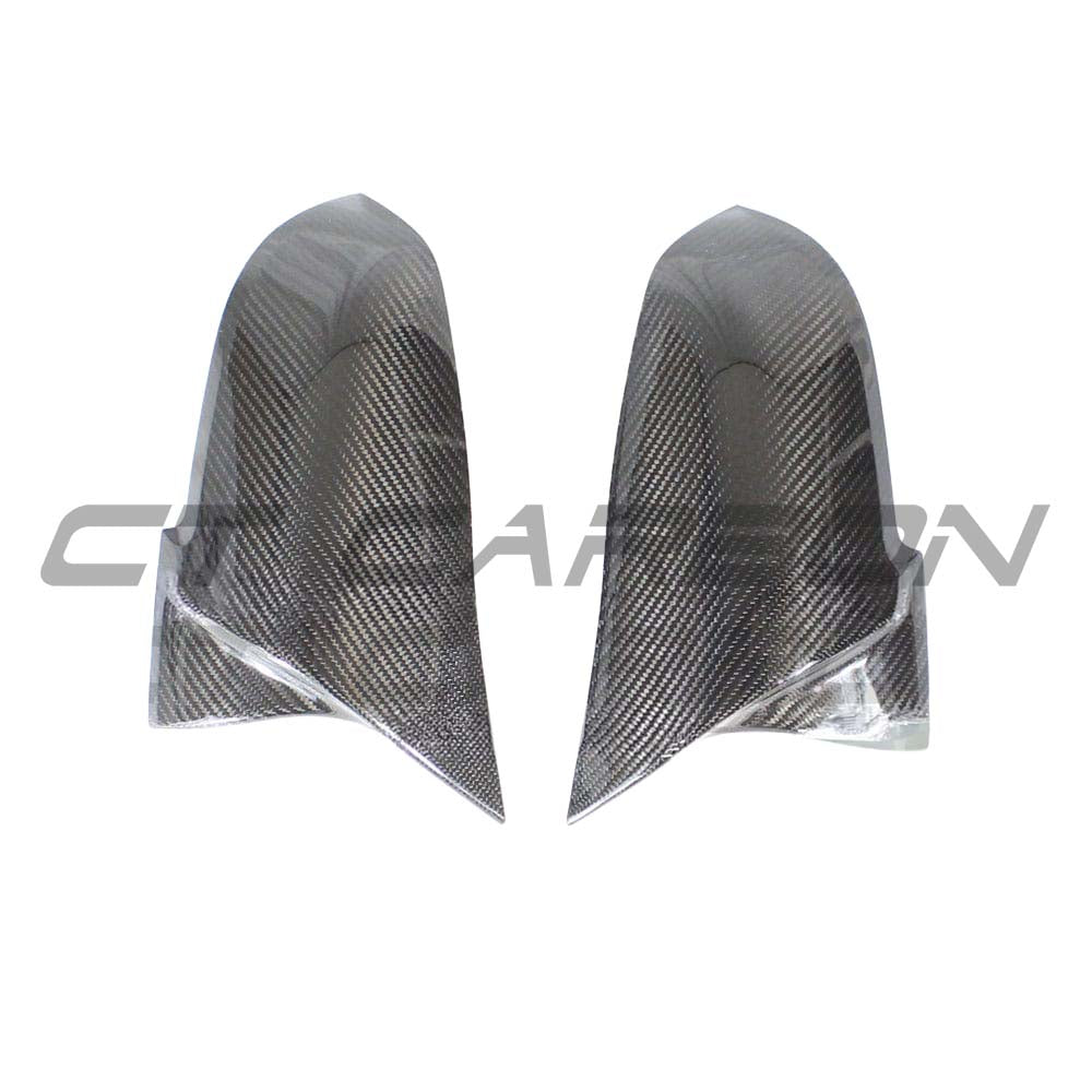 BMW Fxx 1, 2, 3, 4 Series CT Carbon mirror replacement showing split design and OEM M-style finish on sleek carbon fiber surface.