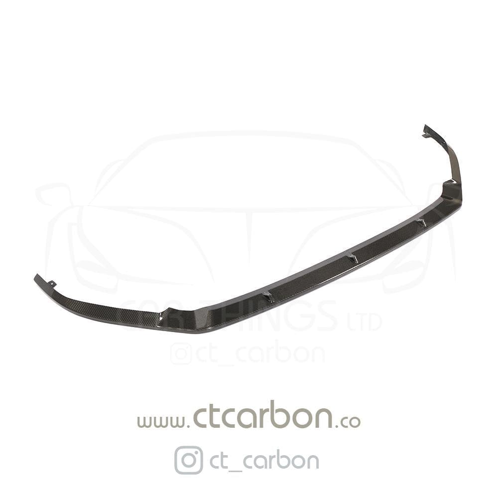 CT Carbon VW Golf R MK7.5 carbon fibre splitter, close-up view showing textured finish and aerodynamic design.