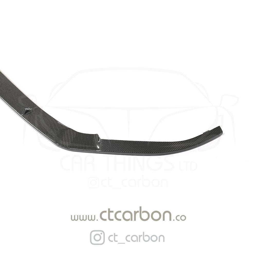 Carbon fiber splitter for VW Golf R MK7.5 by CT Carbon, mounted on front bumper, showcasing sleek aerodynamic design.