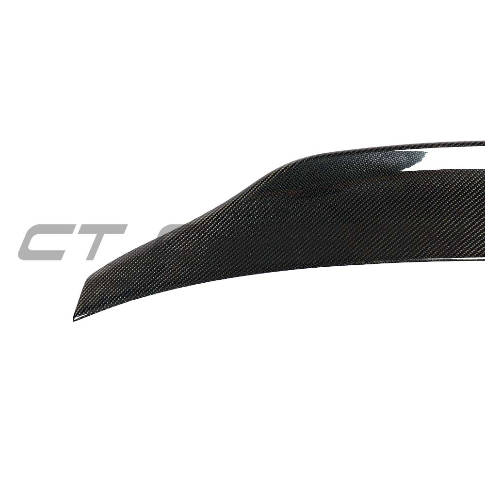 BMW F32 4 Series carbon fibre spoiler by CT Carbon, showcasing a sleek, aerodynamic design for enhanced sporty appearance.