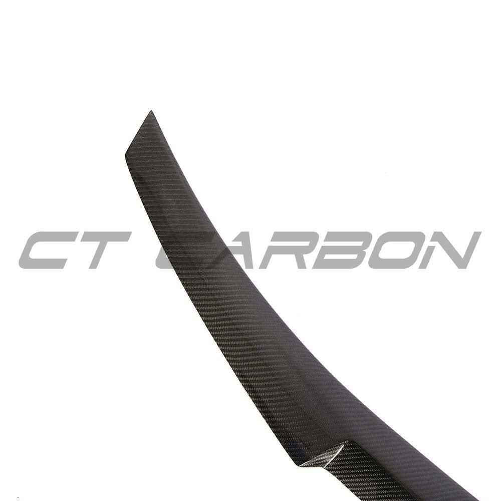BMW F32 4 Series coupe full carbon fiber kit with V-style spoiler and twin exhaust by CT Carbon, showcasing the aerodynamic design.