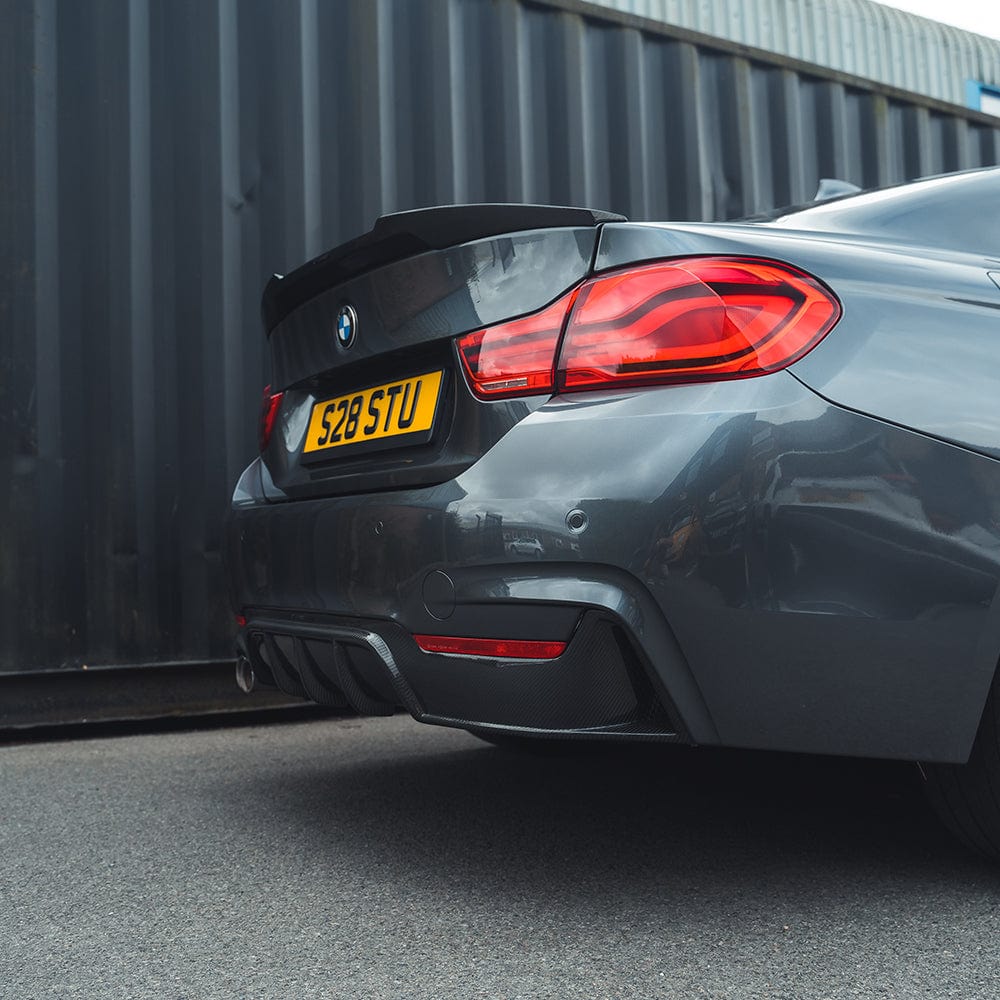 BMW F32 4 Series Carbon Fibre Spoiler by CT Carbon, V1 style, shown mounted on the car's rear for a sporty aerodynamic look.