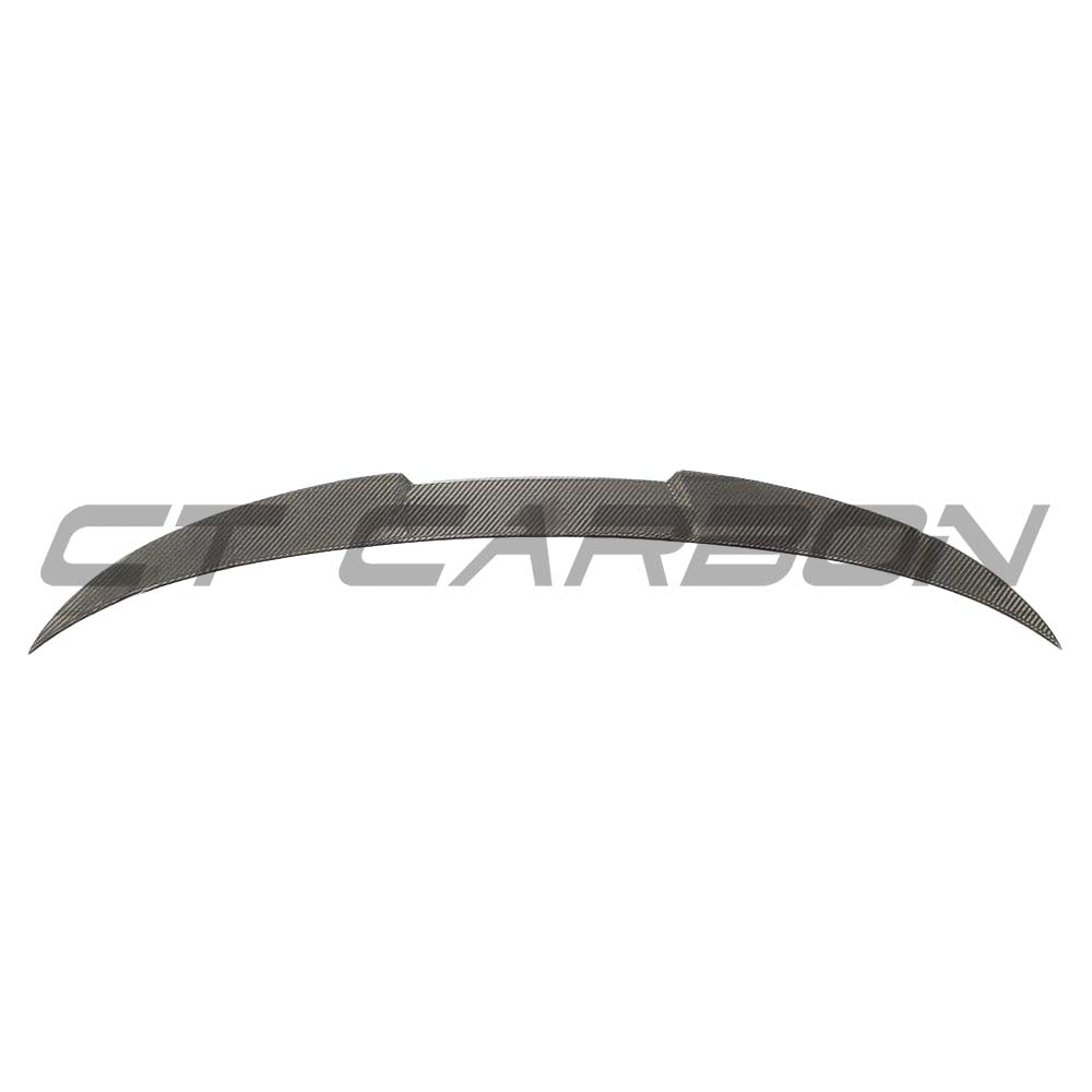 BMW M4 4 Series G83 G23 carbon fiber spoiler by CT Carbon, showcasing a sleek aerodynamic design on the vehicle's rear.