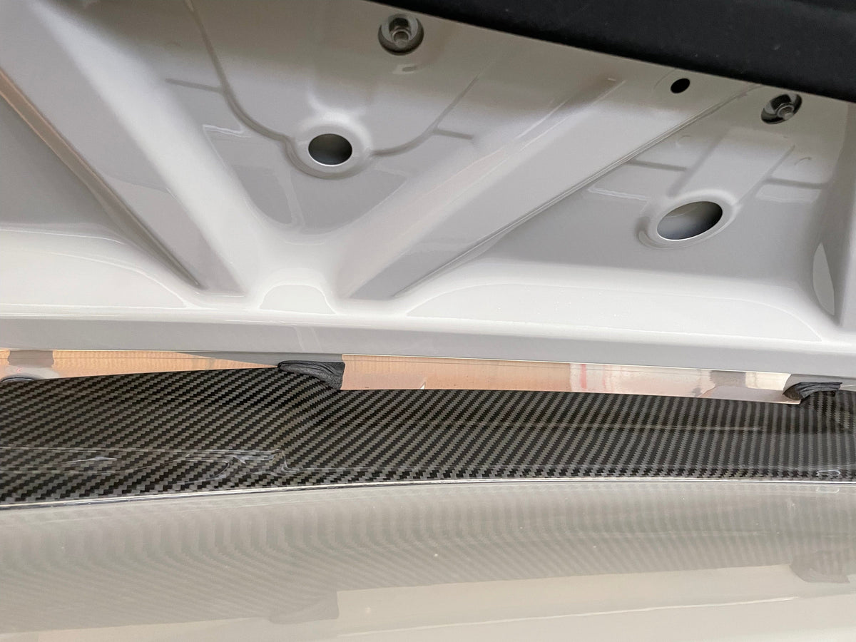 BMW M4 G83 G23 carbon fibre spoiler by CT Carbon, showcasing sleek aerodynamic design and lightweight construction.