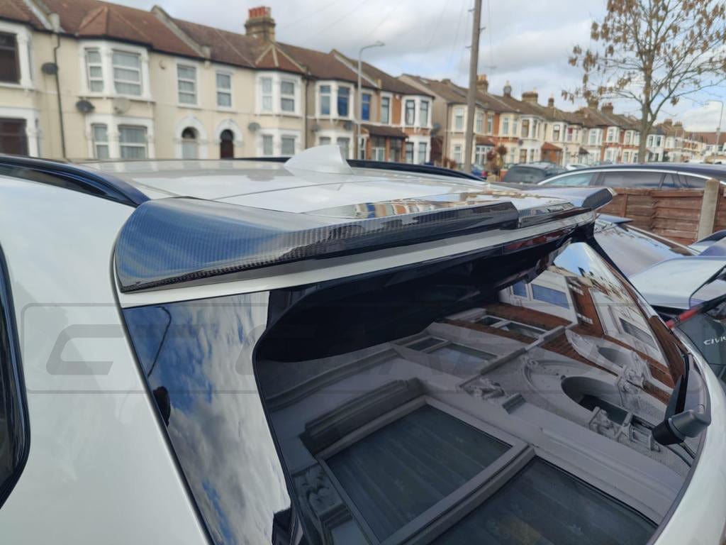 BMW X5 G05 carbon fibre spoiler by CT Carbon, showing sleek, lightweight design and aerodynamic details on the vehicle.