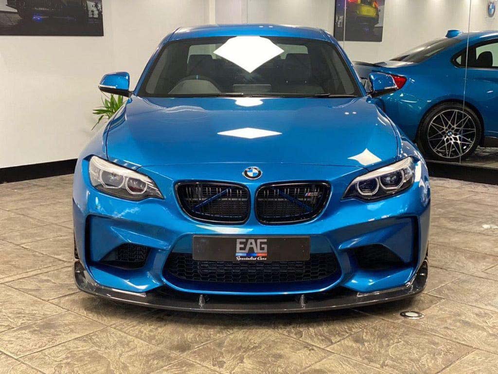 BMW M2 F87 N55 2015-2017 carbon fibre splitter by CT Carbon, showcasing a 3D-style aerodynamic design on the vehicle.