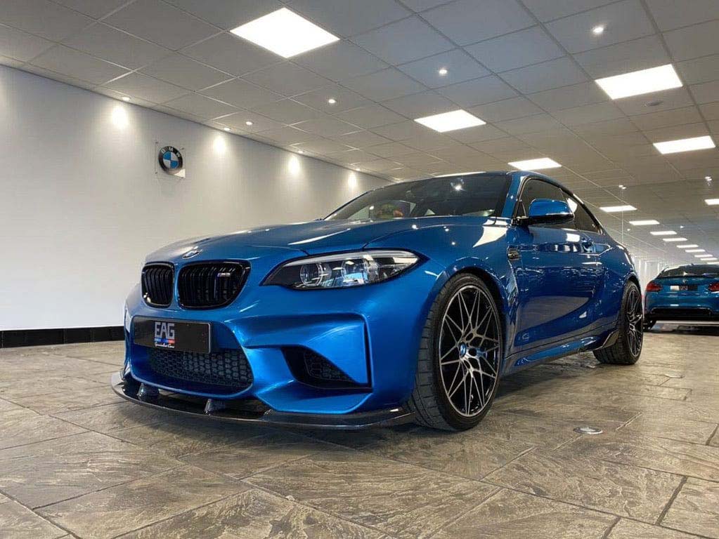 BMW M2 F87 N55 carbon fibre splitter by CT Carbon, showcasing 3D-style aerodynamic design on a black vehicle.