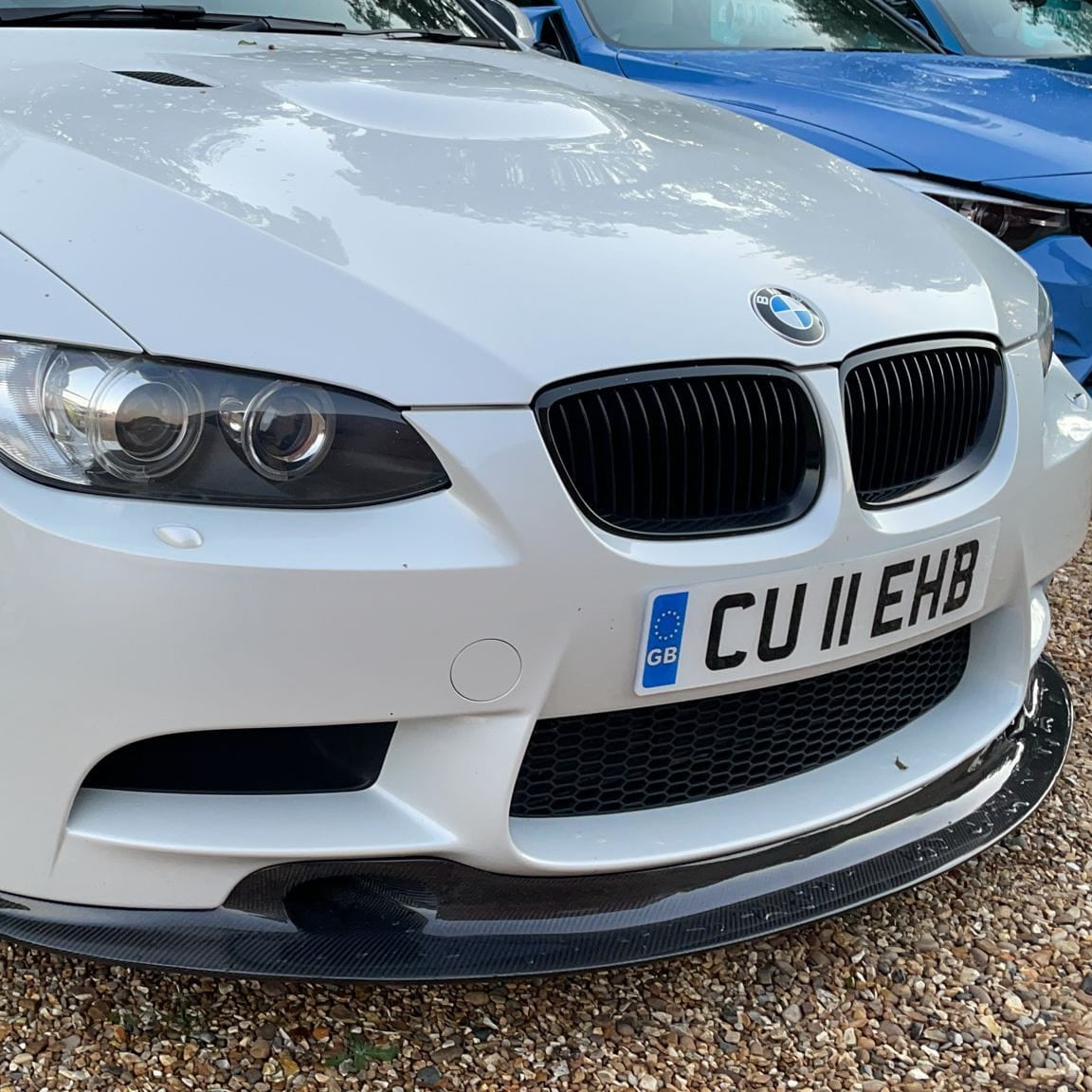BMW M3 E92/E90 carbon fiber splitter V2 by CT Carbon, showcasing the sleek, aerodynamic GT4 style splitter on a sports car.