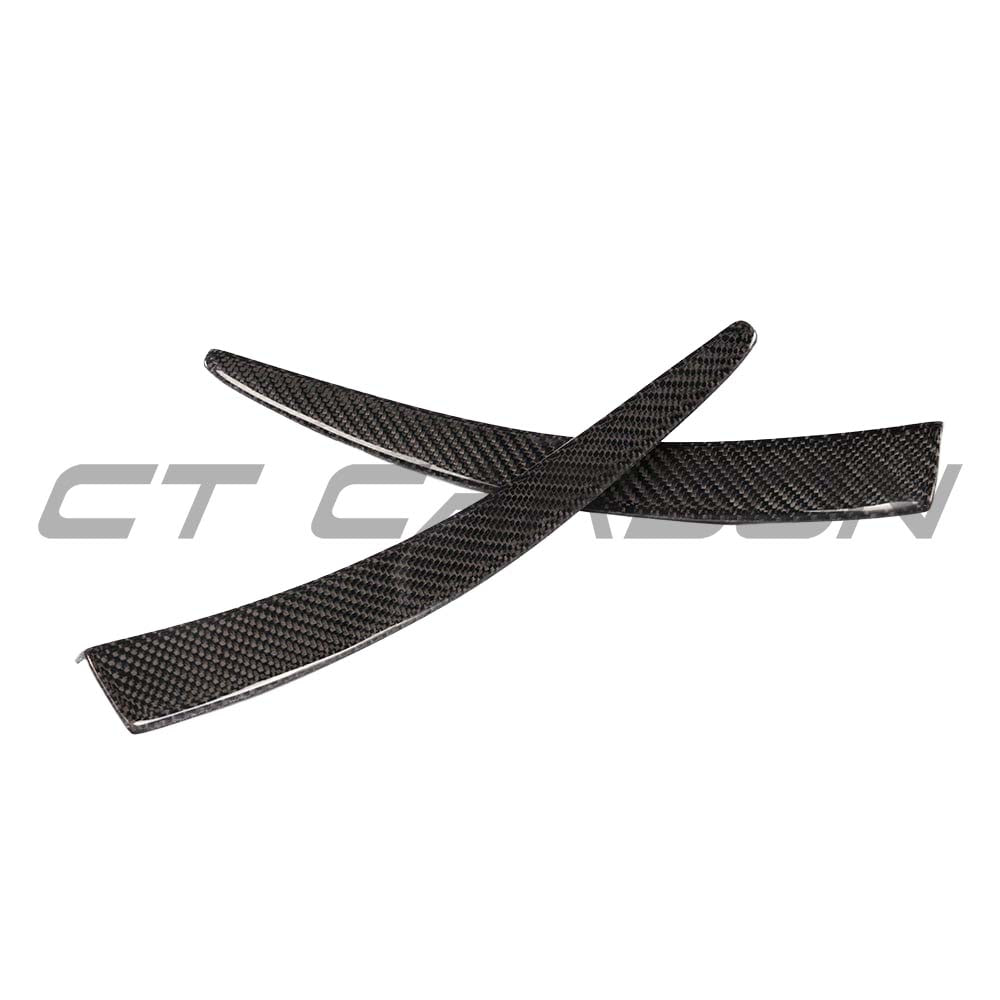 BMW M3 M4 F80 F82 F83 carbon fiber canard fins by CT Carbon, close-up view of aerodynamic vehicle accessories.