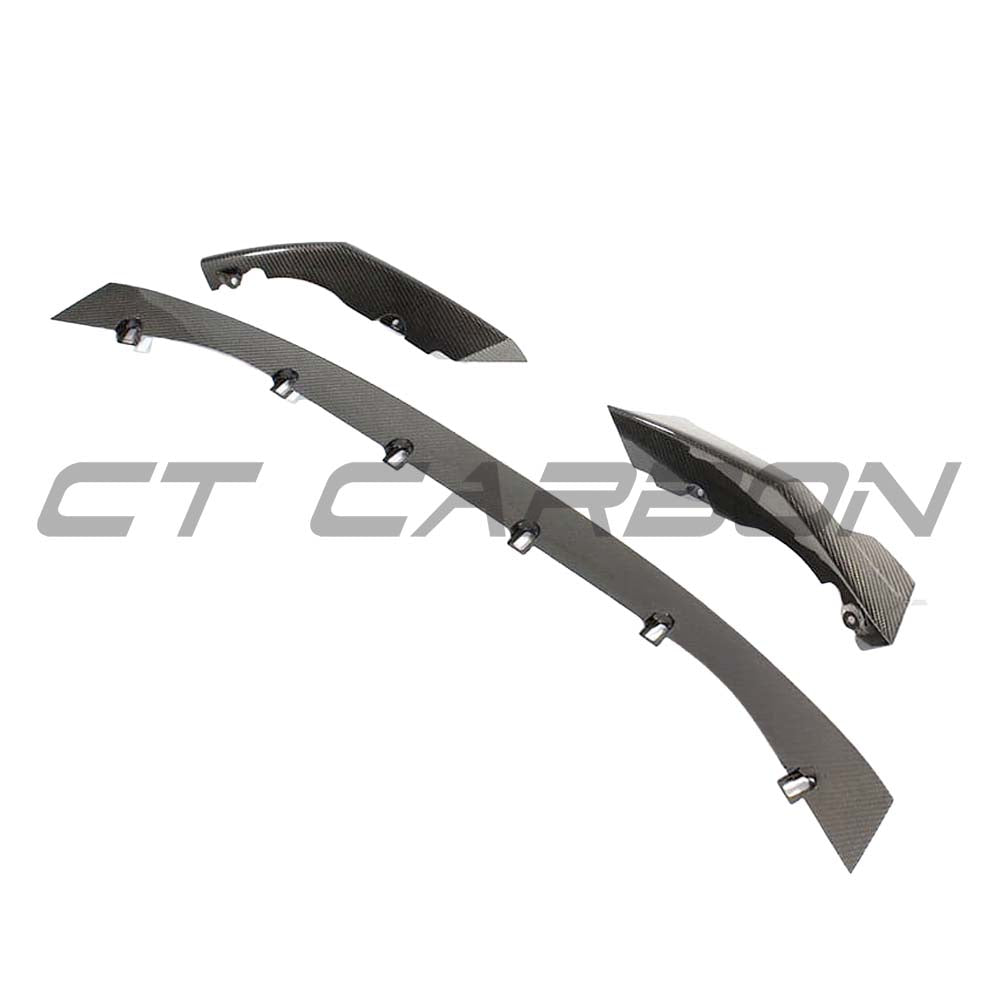 BMW M3 M4 G80 G82 G83 carbon fibre front end pack by CT Carbon, featuring sleek splitters and aggressive styling.