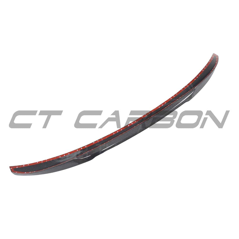 BMW M5 F90 G30 5 Series carbon fiber spoiler by CT Carbon, M4-style, mounted on the vehicle with a sleek, aerodynamic design.