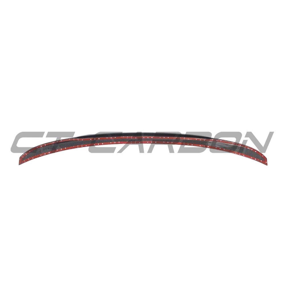 BMW M5 F90 and G30 5 Series carbon fibre spoiler by CT Carbon, M4 style, mounted on the vehicle's rear, showcasing sleek aerodynamic design.