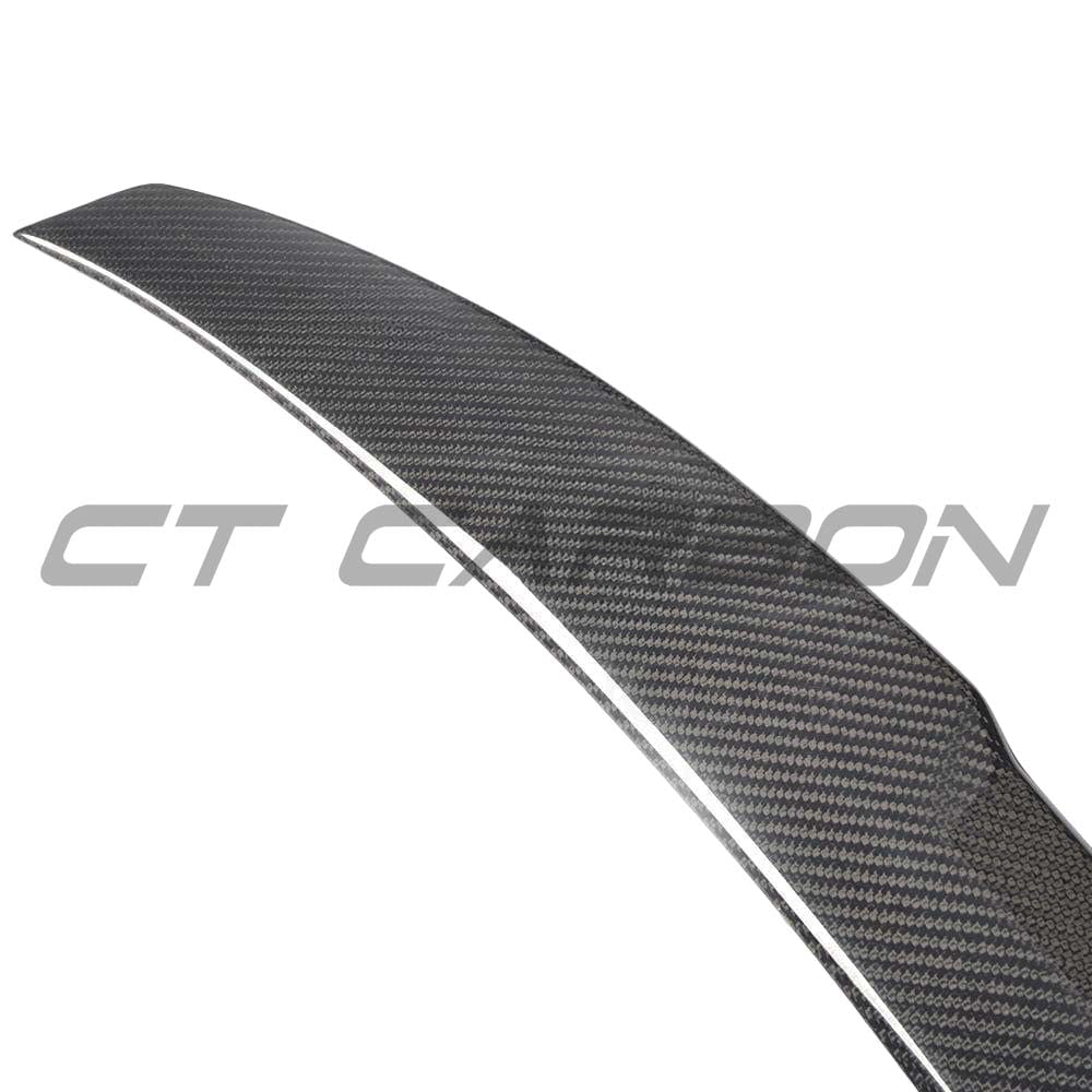 BMW M5 F90 and G30 5 Series carbon fibre spoiler by CT Carbon, M4 style, mounted on vehicle, showcasing sleek aerodynamic design.
