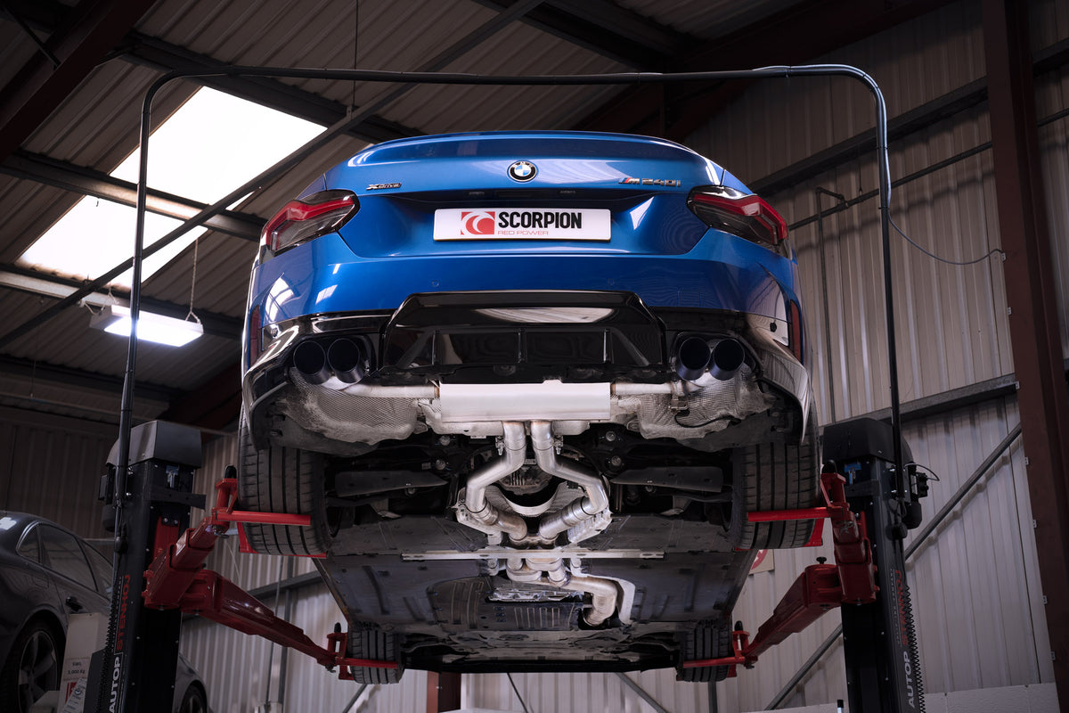 Scorpion BMW M240i G42 GPF-Back Exhaust System with xDrive, featuring electronic valve, installed on a sporty vehicle.